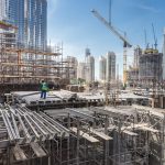 Laborers,Working,On,Modern,Constraction,Site,Works,In,Dubai.,Fast