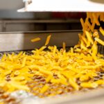 Pasta,Factory.,Close-up,Of,Raw,Pasta,On,Machines,And,Conveyor.